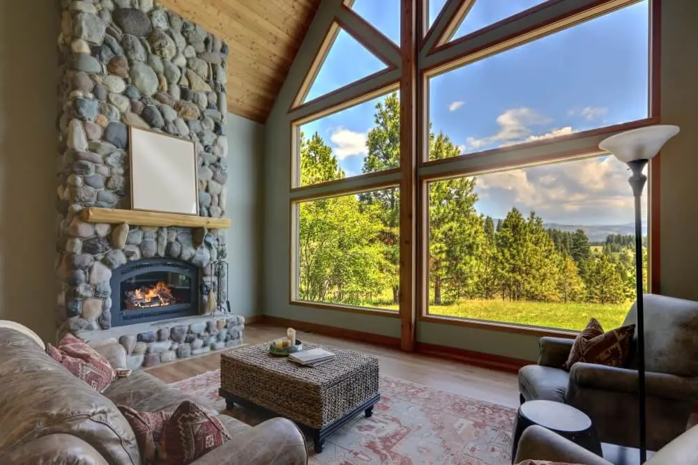 picture windows in a living room with fireplace